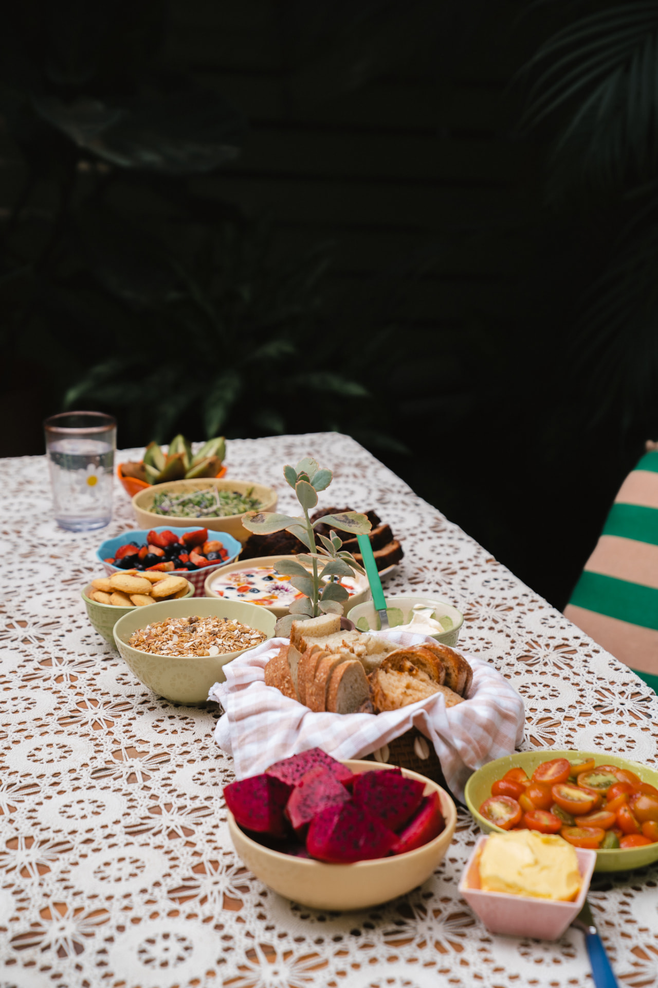 A breakfast table of fruit, granola and fresh bread in Santa Teresa