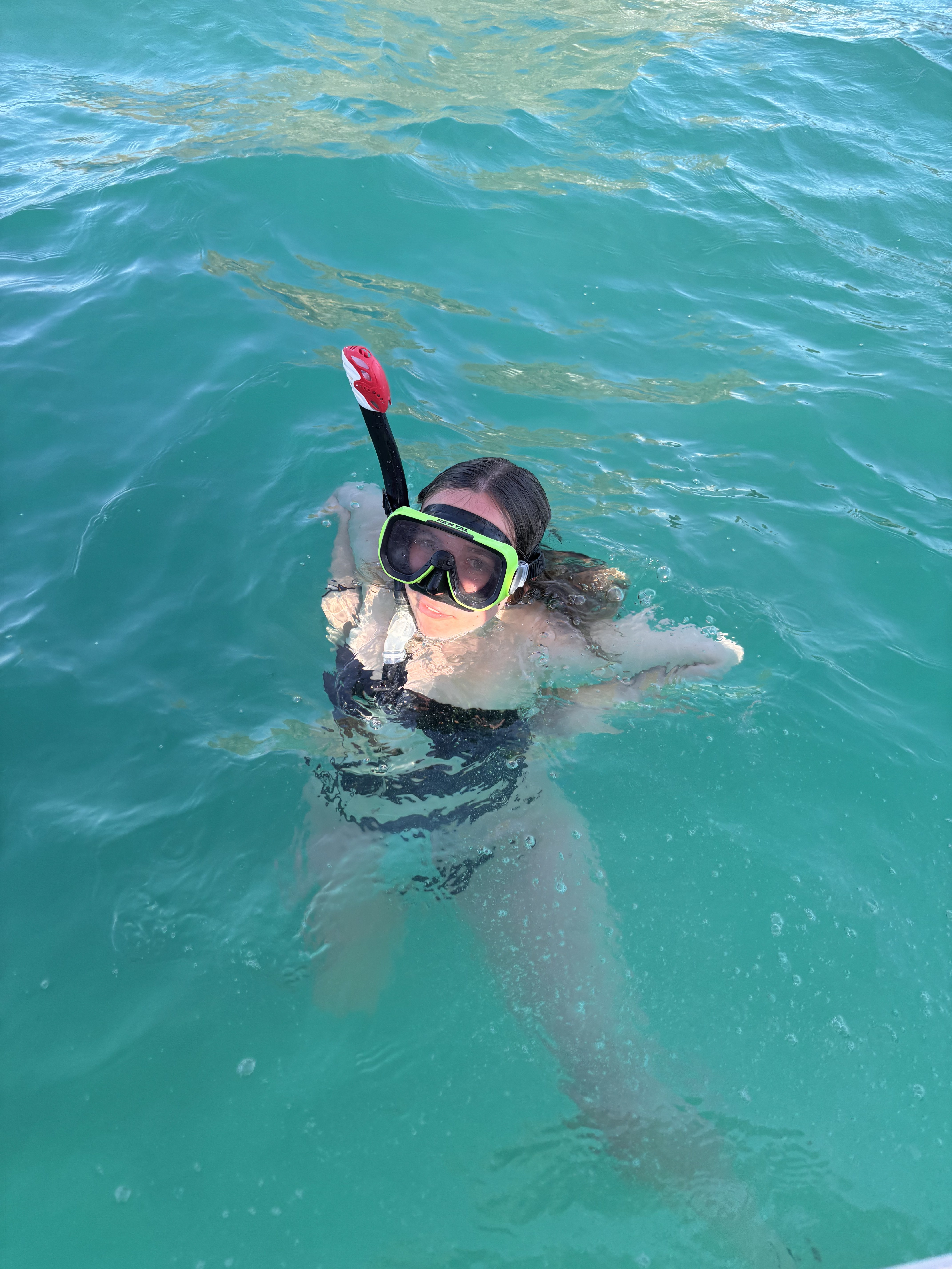 Turquoise water on a boat and snorkel day out of Santa Teresa