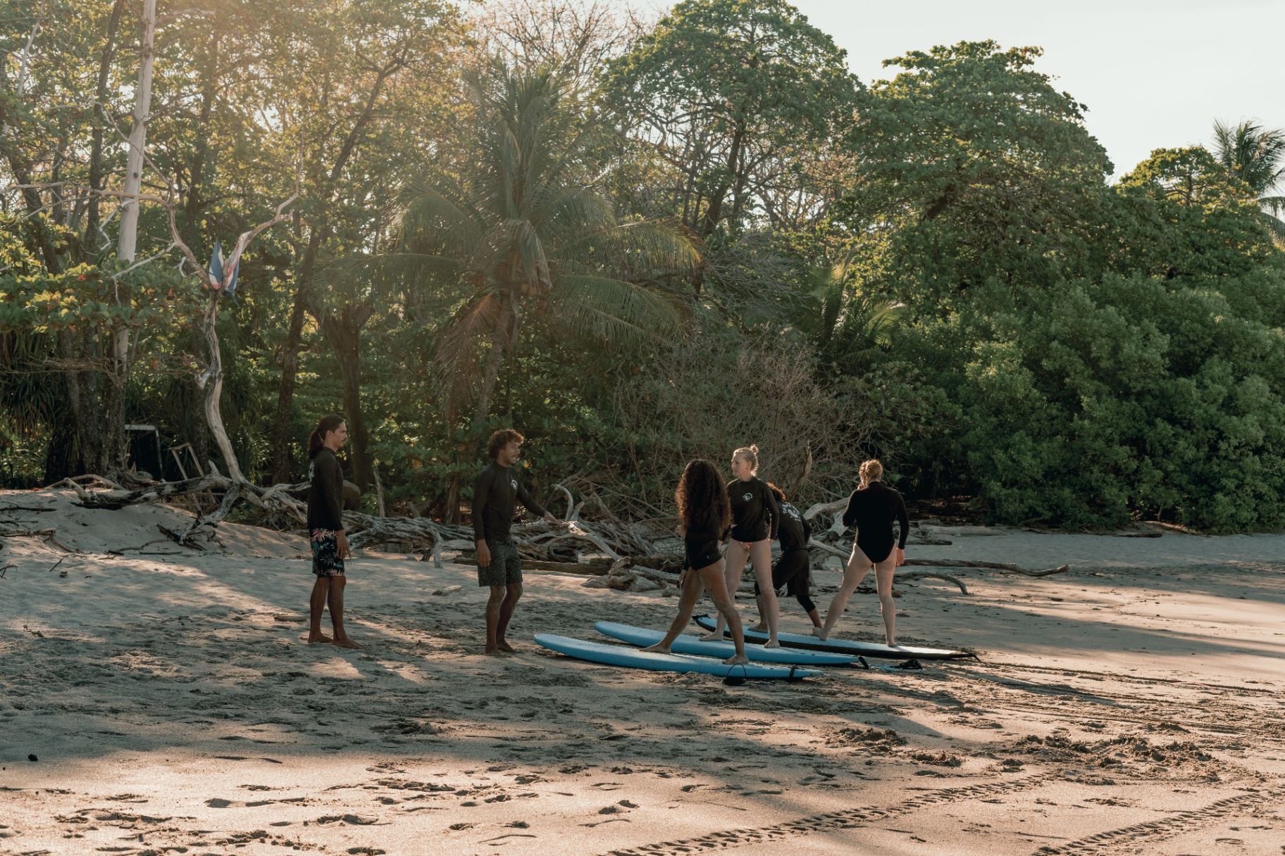 Group surf lesson at sunset in Santa Teresa, Costa Rica