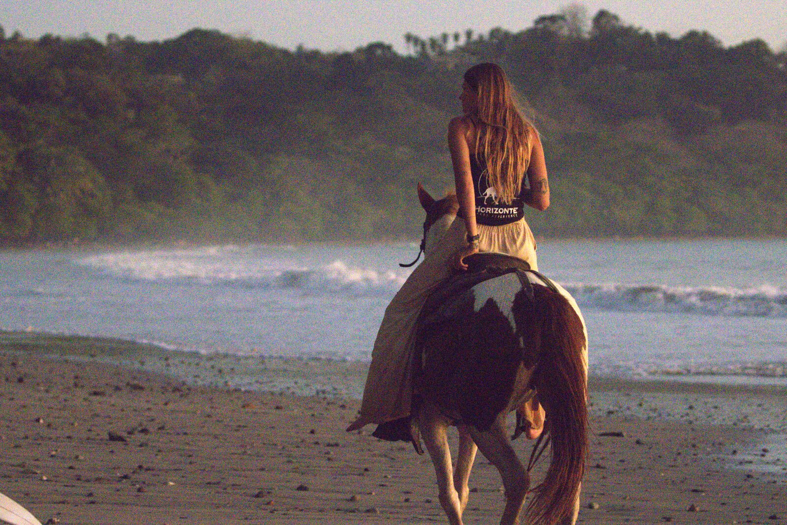Horse riding along the beach in Santa Teresa during the March–April Signature week