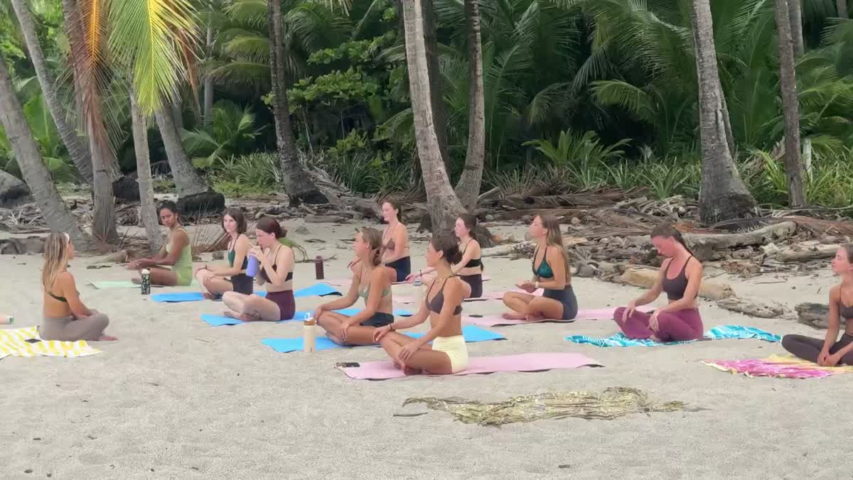 A beachfront yoga class led by Sarah in Santa Teresa